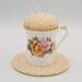 This is a frontal view of the teacup pincushion and trivet. The peonies are really pretty. This is a frontal view of the teacup pincushion and trivet. The peonies are really pretty.